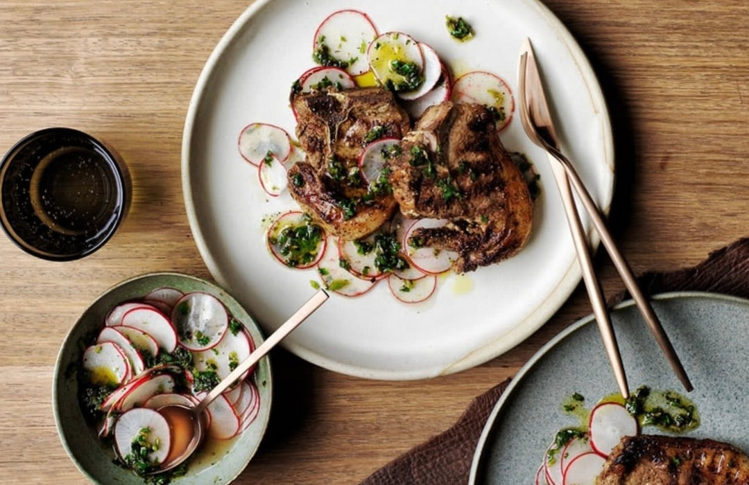 Stout and spice-marinated lamb chops, charred greens and radish salsa.⁠