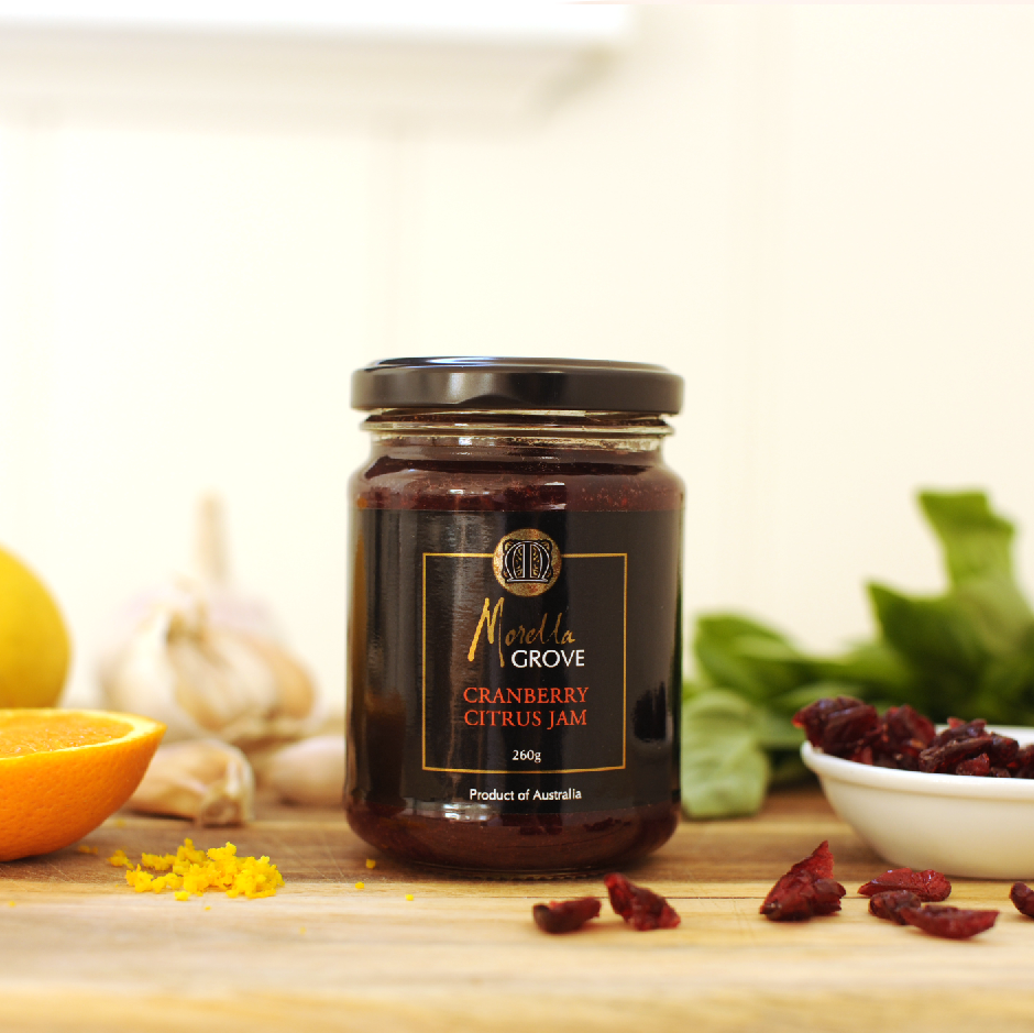 Morella Grove gourmet cranberry citrus jam jar on a table with fruit