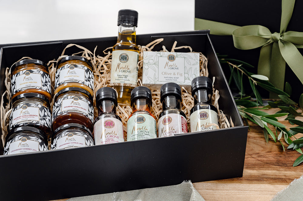 Morella Grove range of products in a gift box including chilli crunch, sauces, relish, soap, vinegars, oil and drizzles
