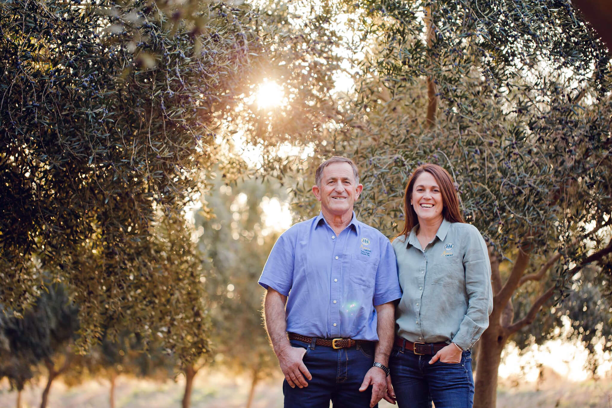 Natasha and Frank DalBon stood in the olive grove